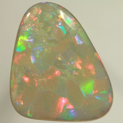 SOLID SEMI BLACK OPAL  Huge opal. Very bright fire, Flagstone Harlequin pattern. Top quality. SEE VIDEO